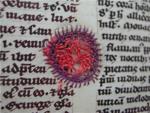 Medieval manuscript mended with embroidery. See http://www.ub.uu.se/en/Just-now/Projects/Completed-projects/A-medieval-book-mended-with-silk-thread/